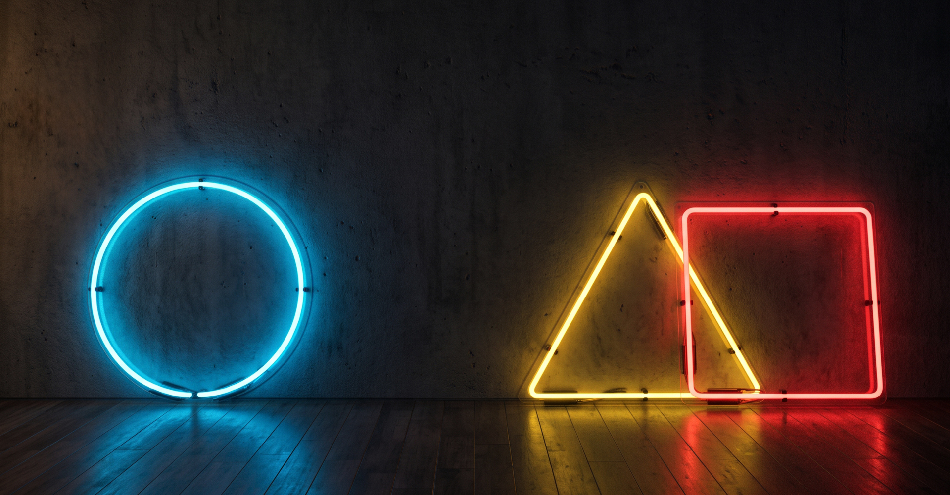 Immagine di un cerchio blu, un triangolo giallo e un rettangolo rosso su sfondo nero.